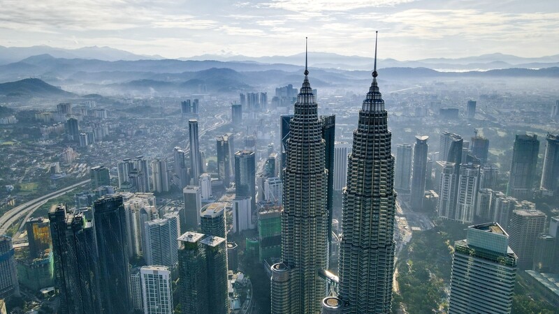 Malaysia has adopted the Transitioning Industrial Clusters (TIC) framework as a national agenda aimed at fostering green economic growth, enhancing job opportunities, and reducing carbon emissions. The TIC initiative, launched globally by the World Economic Forum at COP26, unifies industrial clusters to promote economic, social, and environmental value through collaborative efforts. Malaysia's Prime Minister emphasized the framework's role in aligning companies and public institutions for strategic industrial development. Key priorities include developing state-level strategies, formalizing governance structures, and launching cluster projects, particularly in Sarawak, Johor, and Selangor, focused on sustainable industries and technologies.