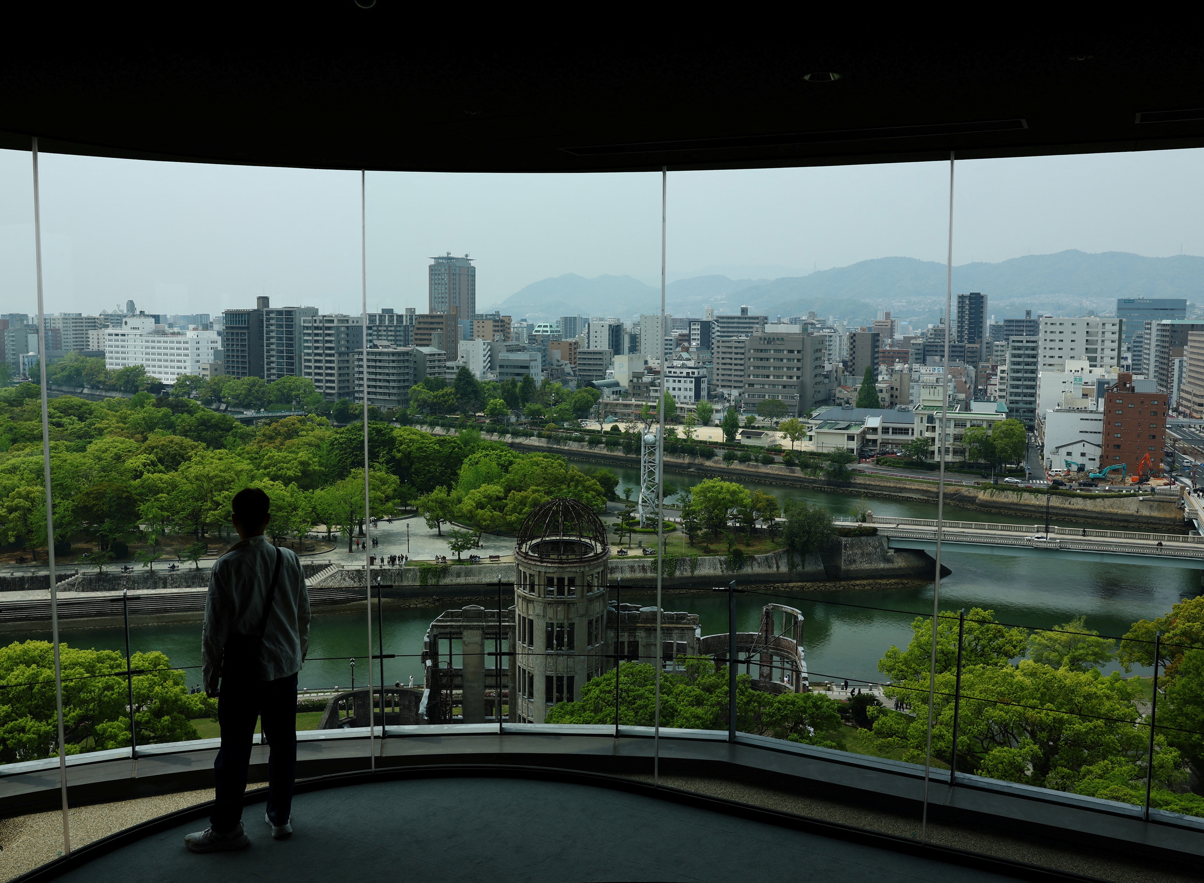 Japan emphasizes the importance of preserving wartime memories as part of its peace initiatives, especially as the population ages and survivors dwindle. The 80th anniversary of World War II underscores efforts to pass down experiences through programs training young "kataribe" or narrators. Innovative technologies, like AI-powered interactive storytelling, help bridge the gap between survivors' testimonies and younger audiences. Museums also foster empathy through immersive exhibitions, such as the "Peace in the Dark" program, allowing participants to experience pre-bombing life in Hiroshima. These initiatives aim to ensure the lessons of war are not forgotten.