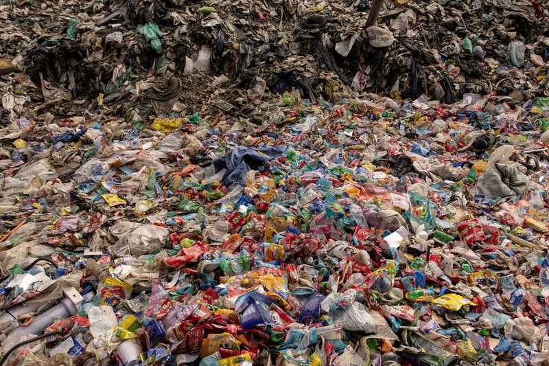 Plastic pollution significantly contributes to climate change, accounting for 3-5% of global greenhouse gas emissions, surpassing those of the aviation industry. With production projected to triple by 2060, plastics threaten the world’s ability to limit warming to 1.5 degrees Celsius. Addressing plastic production and promoting reusable systems can reduce emissions by up to 0.5 gigatonnes annually. Global negotiations are shifting from waste management to reducing virgin plastic production, presenting a critical opportunity to mitigate climate impacts, create jobs, and improve local economies through sustainable practices.