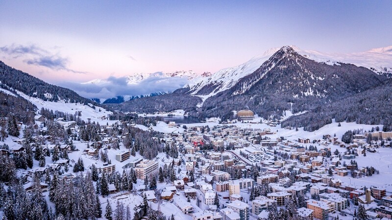 The World Economic Forum's Annual Meeting 2026, themed ‘A Spirit of Dialogue’, will convene leaders from various sectors in Davos, Switzerland, from January 19-23. Key topics include green growth, resilience economics, and minilateralism, highlighting global challenges that necessitate collaboration. Emerging terms anticipated at the forum include "AI slop," referring to low-quality AI-generated content, "electron gap," which describes the disparity in electricity production between the US and China crucial for AI development, and "inclusive AI," emphasizing equitable participation in AI’s growth. The event will also address transformative technologies like quantum computing and suptech for a more resilient financial system.
