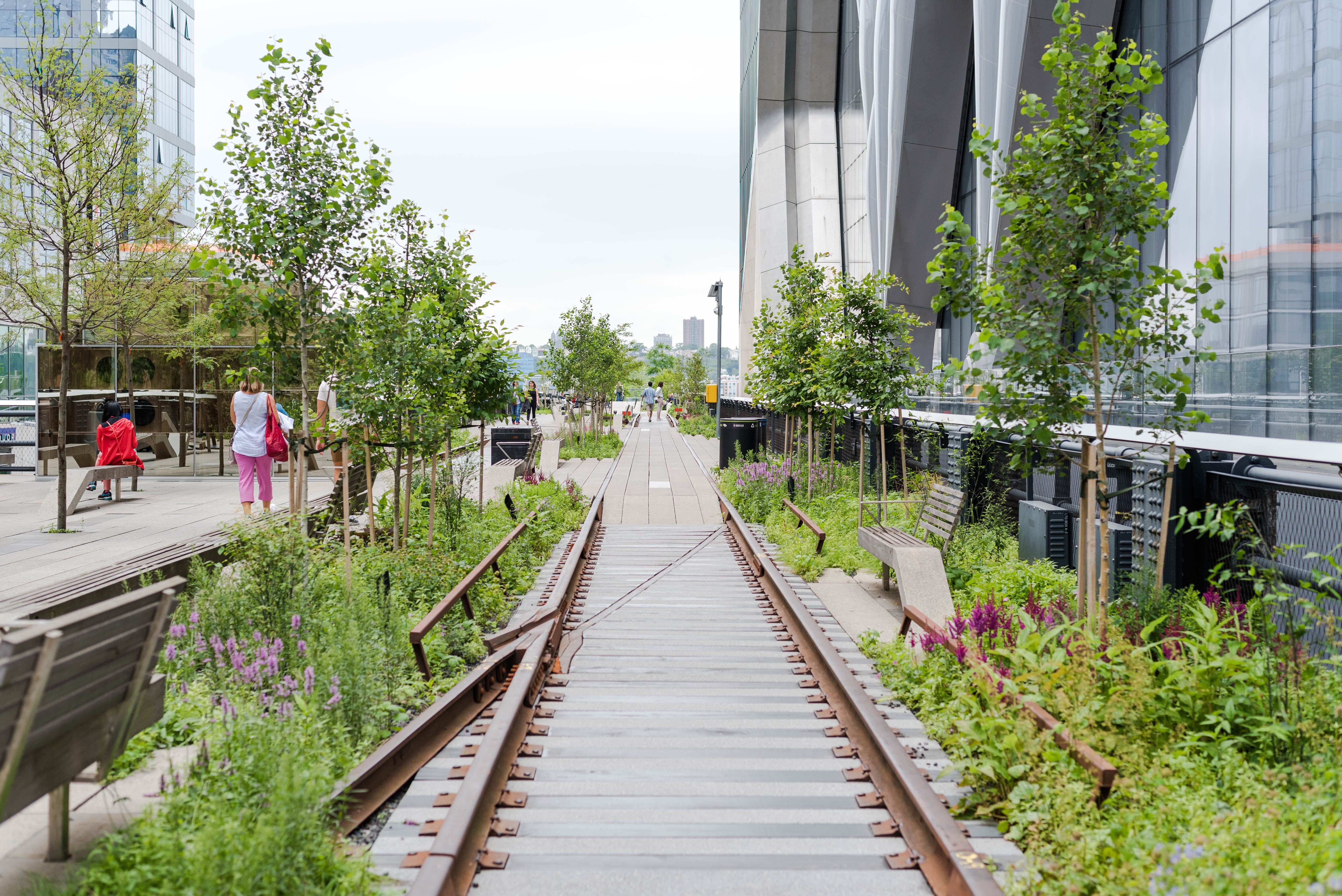 Adaptive reuse is a strategy that repurposes existing buildings for new uses, addressing urban challenges while preserving architectural heritage. Cities are increasingly adopting this approach to reduce waste, cut emissions, and support the circular economy amid climate and resource constraints. Successful examples, like the Tate Modern in London and the High Line in New York, show how transformed spaces can revitalize local economies and communities. With significant carbon savings and less construction waste compared to new builds, adaptive reuse offers financial benefits as well, making it an essential tool for sustainable urban development and addressing housing and public service needs.
