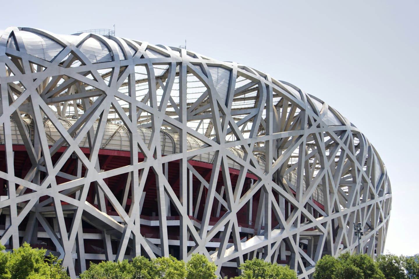 In 2025, Chinese companies significantly expanded their engagement in the Belt and Road Initiative (BRI), with construction deals reaching $128 billion (up 81% from 2024) and investments totaling $85 billion (up 62%). This shift marks a departure from the earlier focus on "small and beautiful" projects, with average investment values rising substantially. Energy remained the dominant sector, accounting for 43% of total engagement, though fossil fuel projects outnumbered renewables significantly. Notably, Africa emerged as the top destination for Chinese overseas projects, indicating an evolution in BRI strategy towards larger scale and diversified investments.