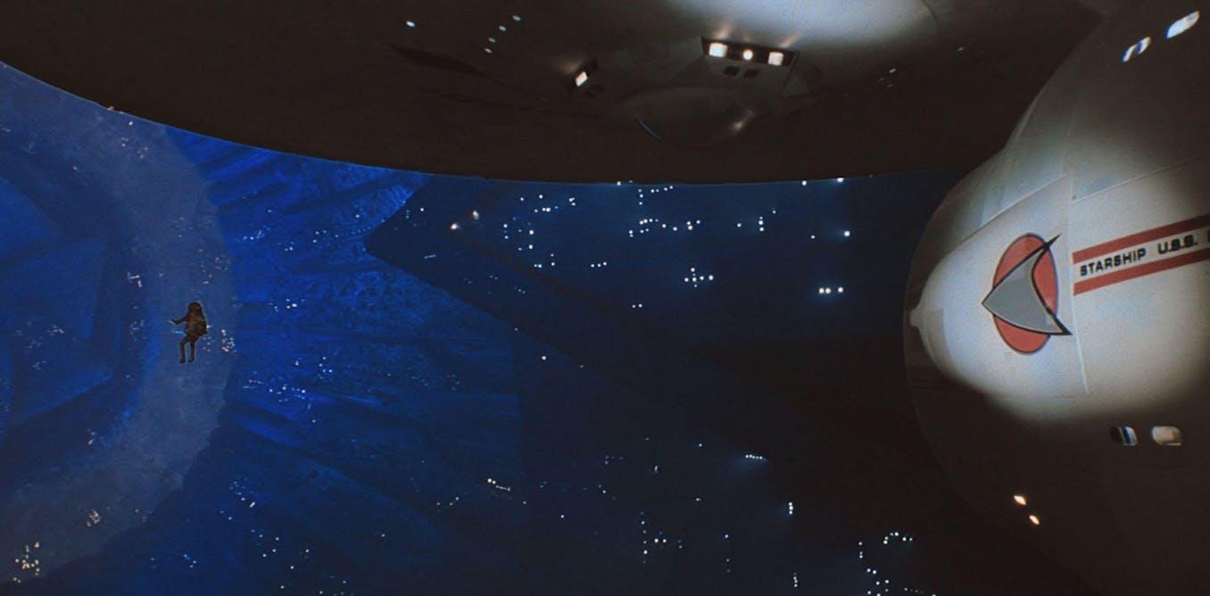 Star Trek popularized the concept of wormholes as tunnels through spacetime connecting distant locations, inspiring interest in their scientific basis. Early portrayals, such as in Star Trek: The Motion Picture (1979), depicted wormholes as distorted spacetime regions affecting starship systems but not accurately showing traversal or endpoints. The theoretical framework for traversable wormholes arises from Einstein’s general relativity, requiring exotic matter with negative pressure to stabilize spacetime curvature. Wormholes might connect distant places or universes, with normal time passage experienced by travelers inside, though differing elapsed times could occur relative to outside observers. While science fiction simplifies some effects like time distortion, wormholes remain a fascinating possibility supported by physics.