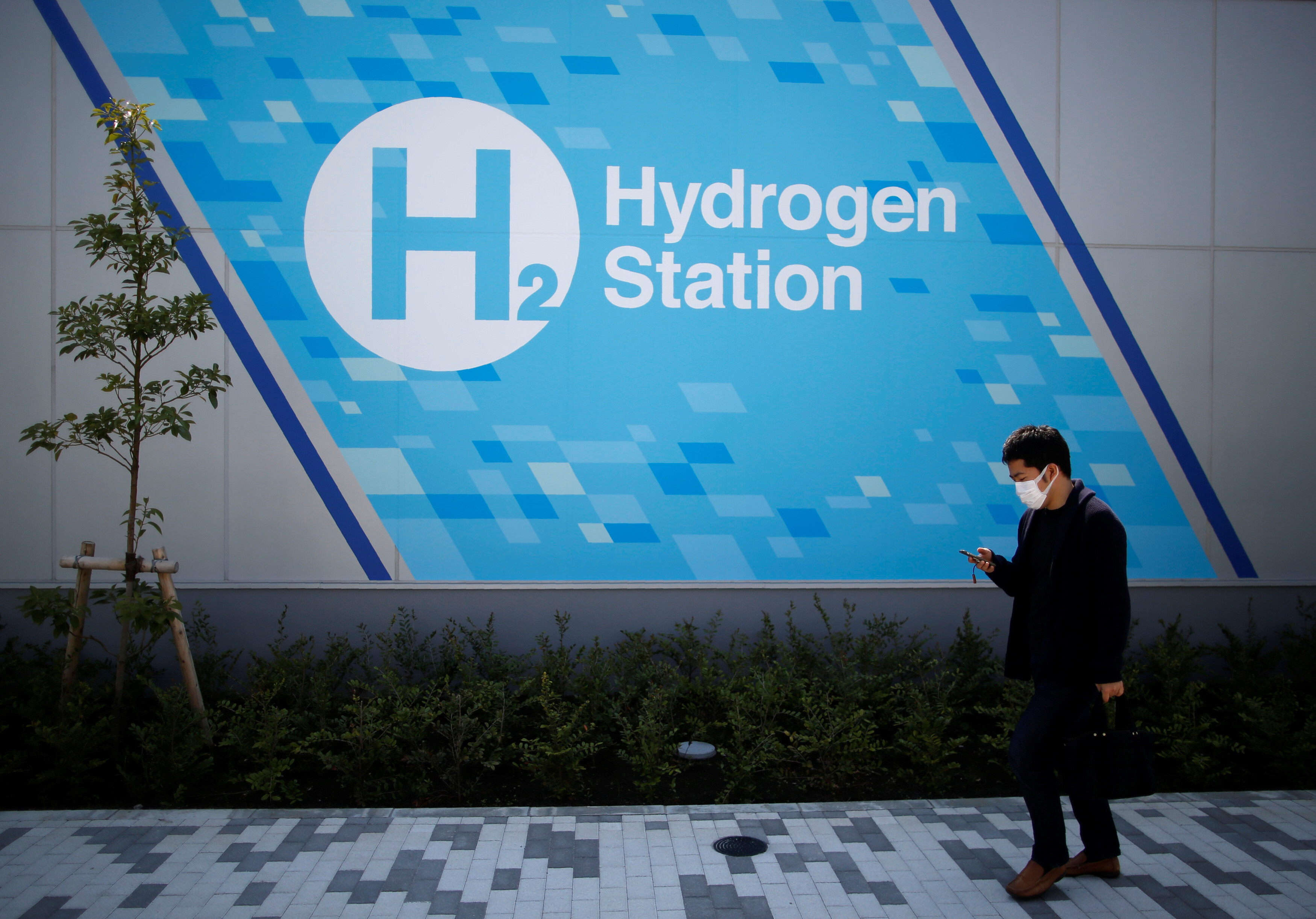Japan aims to establish a 'hydrogen society' by integrating hydrogen across multiple sectors, including transportation, steel production, and energy. The country’s ambitious hydrogen strategy, initiated in 2017, has evolved to prioritize safety, energy security, economic efficiency, and environmental sustainability, amidst practical challenges. Japan's energy insecurity, stemming from heavy reliance on energy imports, drives its hydrogen initiative, but high costs and dependence on foreign supplies pose significant hurdles. Despite plans to procure 12 million tons of hydrogen annually by 2040, uncertain demand and an underdeveloped global supply chain keep the future landscape ambiguous.