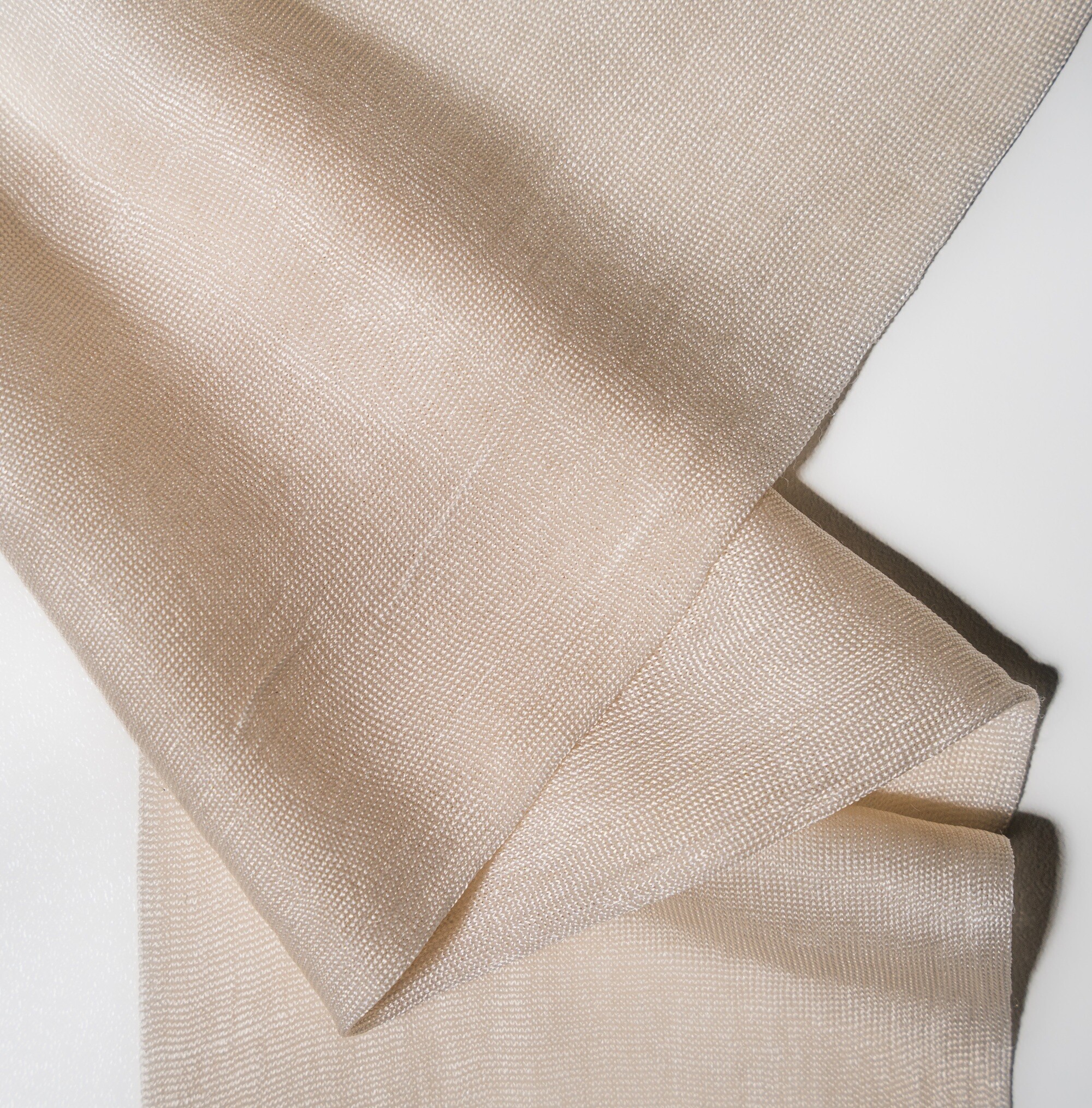 Bio-fermented silk fiber offers a sustainable, high-performance alternative to traditional silk and other animal-derived materials, leveraging AI-driven protein engineering and precision bio-fermentation. This innovative approach reduces environmental impact, contributes less than 20% to overall production burdens compared to conventional methods, and supports a circular economy due to its biodegradability. With extensive market potential across various industries, including textiles and automotive, biofabricated materials are positioned to disrupt the fabric industry by meeting rising demands for eco-friendly and scalable solutions.