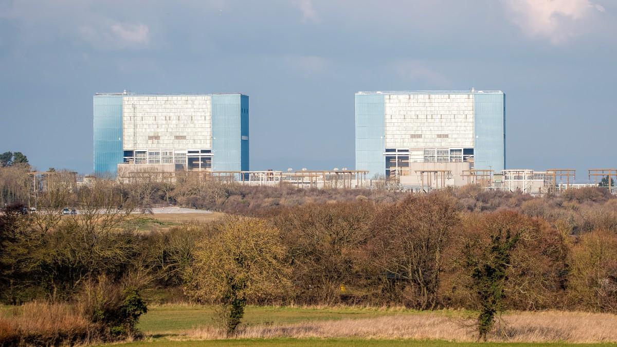 Nuclear energy is positioned as a crucial element in Britain’s plans to achieve net-zero targets, aiming to quadruple its capacity by 2050. Projects like Hinkley Point C and Sizewell C, alongside the introduction of small modular reactors (SMRs), promise to modernize nuclear energy. However, challenges remain, including high costs, logistics, and public opposition. The British Energy Security Strategy targets 24 gigawatts of nuclear capacity, emphasizing energy independence and job creation, while financing and waste management concerns linger. Even amidst renewed support, nuclear's role in a renewable-dominant energy landscape is uncertain.