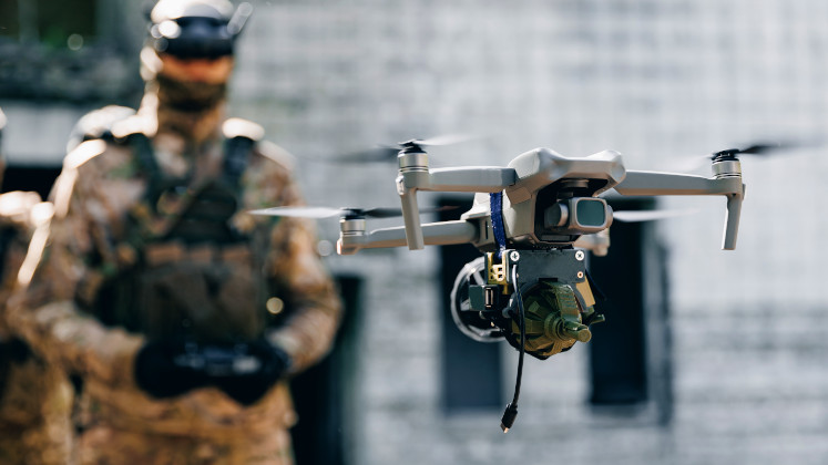Drones have been crucial in Ukraine's defense during the Russia-Ukraine war, showcasing an innovative drone warfare ecosystem. The report emphasizes that success relies not just on drone technology but also on a supportive network of diverse actors, including military, civilian experts, and industry. Key factors for NATO allies to consider are the speed, scale, and urgency of Ukraine’s decentralized approach, which fosters rapid iteration and community involvement. With over 200 drone types developed, Ukraine is streamlining the most effective systems for increased production and support to allies, urging others to adapt swiftly to these lessons.